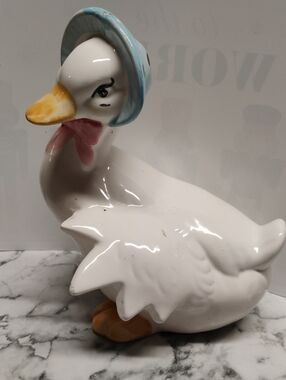 Glossy White Ceramic Duck with Blue Bonnet and Pink Bow